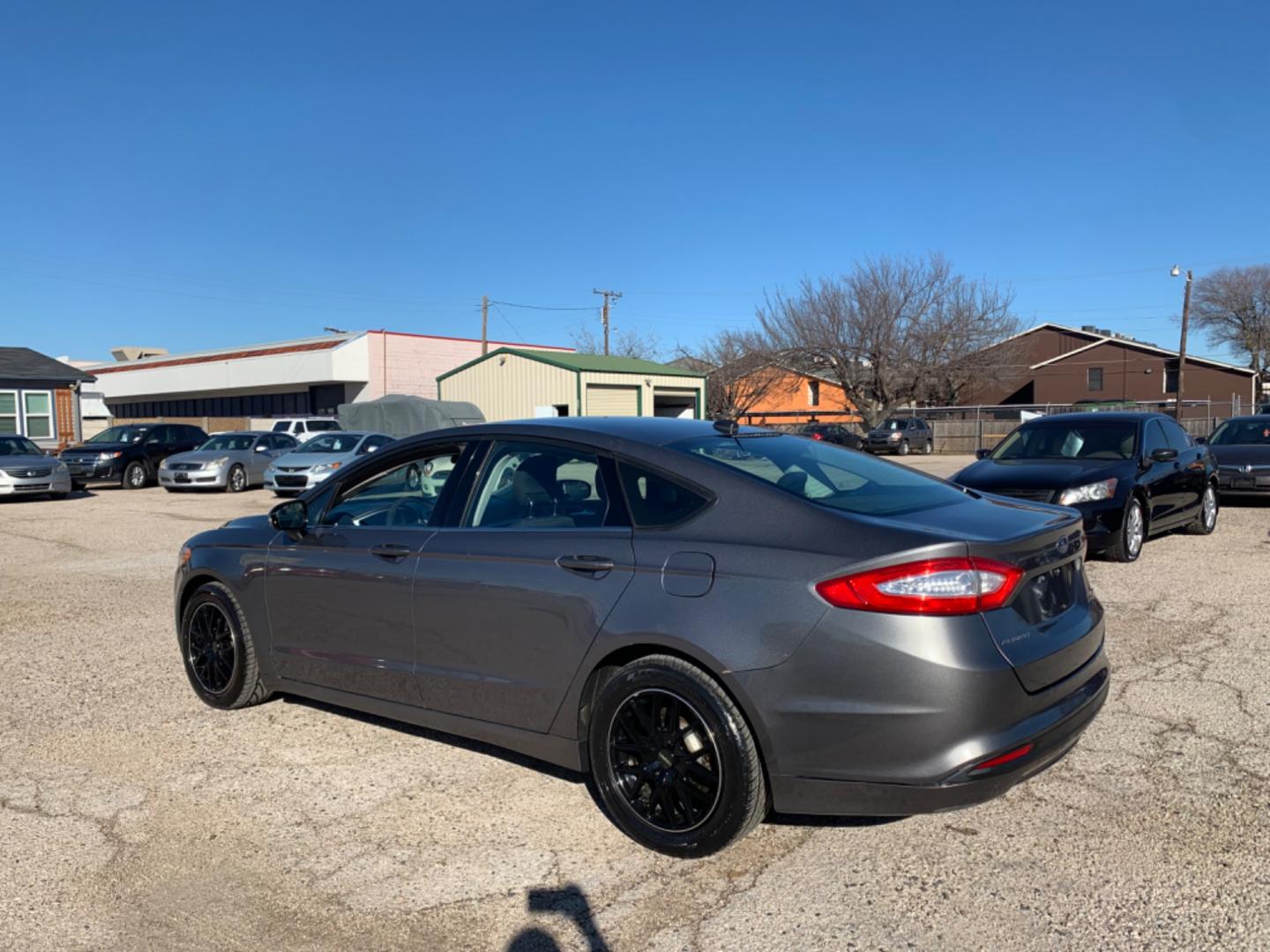 2013 Black /Black Ford Fusion (3FA6P0H79DR) with an 4 Cylinders D 1.5L DI Turbo DOHC 091 CID engine, AUTOMATIC transmission, located at 1830 North Belt Line Road, Irving, TX, 75061, (469) 524-0199, 32.834373, -96.993584 - Photo#3